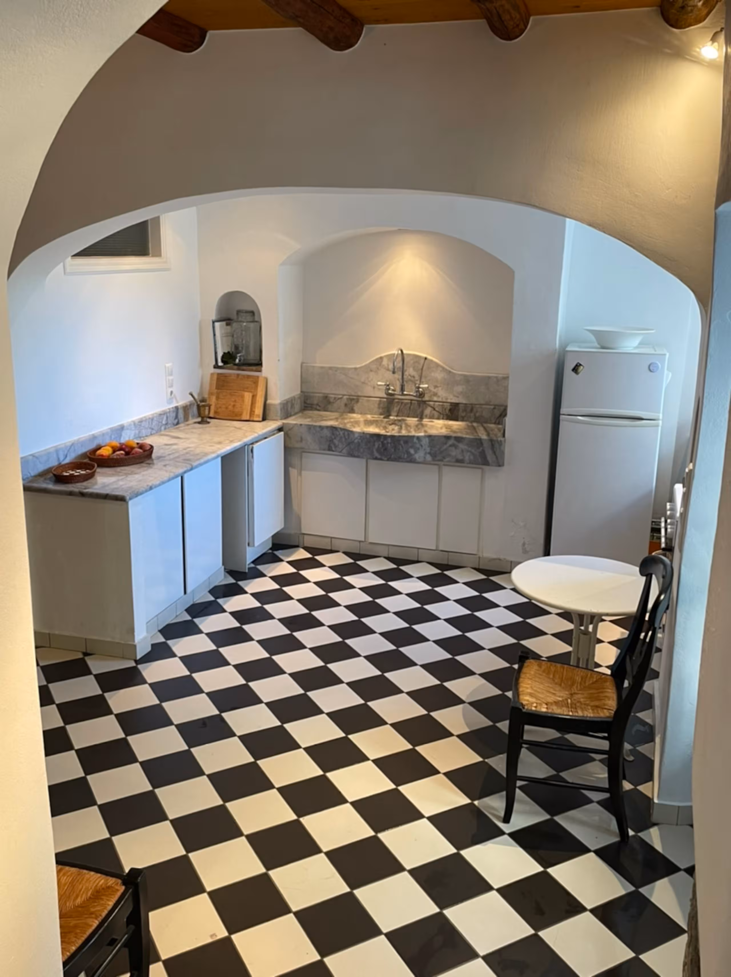 Rustic checkerboard kitchen with marble counters